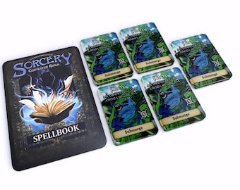 May include: A tabletop game set featuring a spellbook and several cards. The spellbook is black with the word "SORCERY" and "SPELLBOOK" in white. The cards have a frog illustration and the word "Submerge".