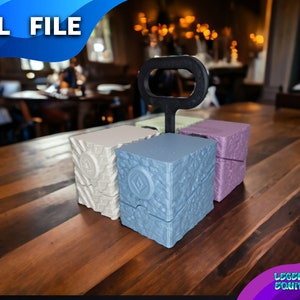 May include: Four 3D printed cube boxes with a textured surface. The boxes are in different colors: white, light blue, green, and purple. A black handle is attached to the top of the boxes. The boxes are sitting on a wooden table. The text "LEGENDARY EQUIPMENT" is visible in the bottom right corner of the image.