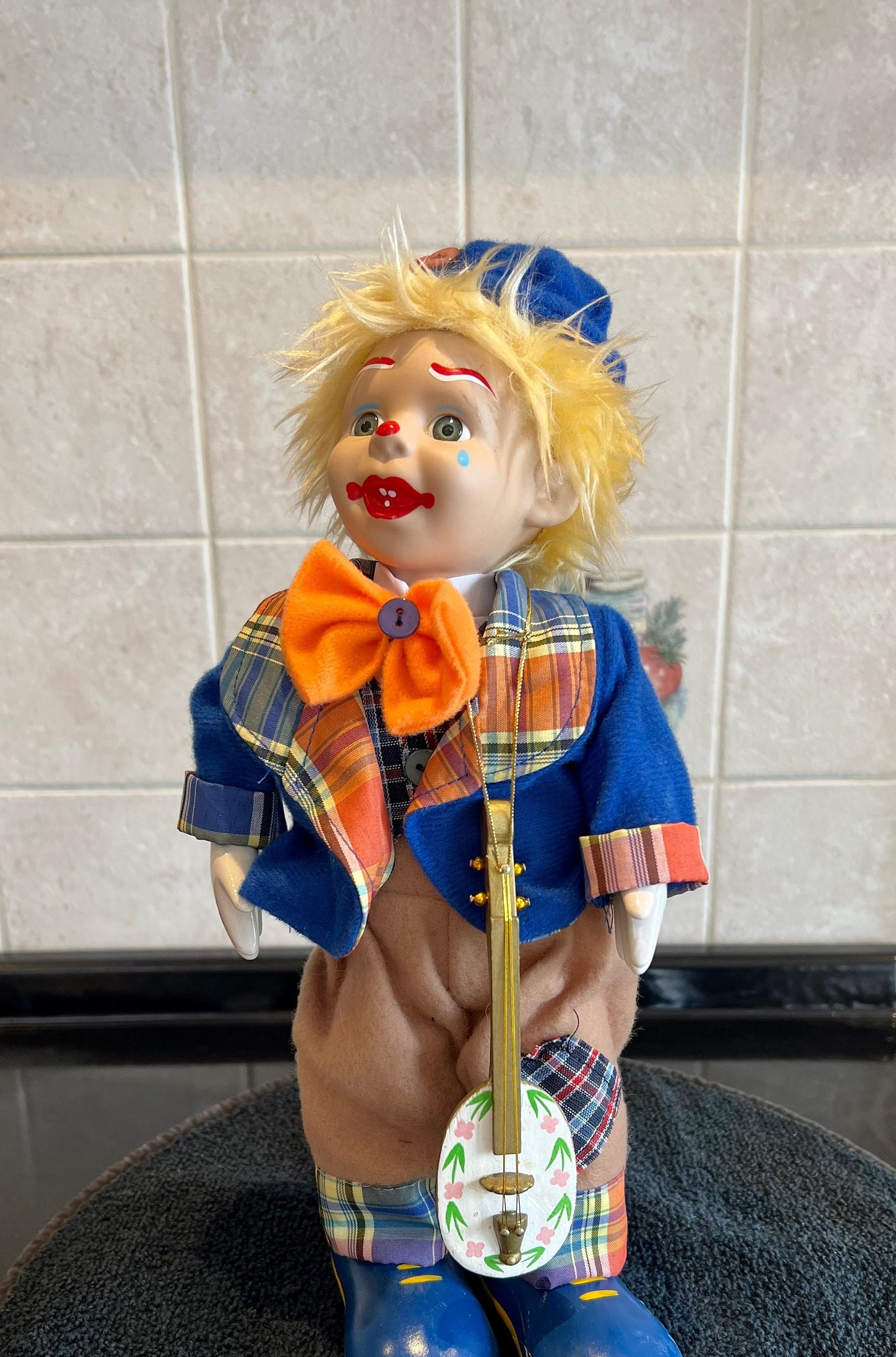 Wind up musical porcelain clown doll discount