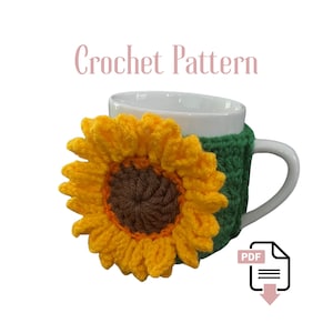 May include: A white mug with a yellow, brown, and green crochet sunflower cozy. The cozy is wrapped around the mug, with the sunflower design on the front. The text "Crochet Pattern" is above the mug.