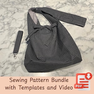 May include: A black and white houndstooth pattern tote bag with a matching wrist strap. The bag has a long strap and a bow detail. The wrist strap has a silver-colored clasp. The bag is on a marble surface.
