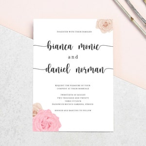 May include: A white wedding invitation with the names "Bianca Monic" and "Daniel Norman" in elegant script. The invitation includes the date, time, and location, with floral accents in the corners. The background is a light pink and gray.