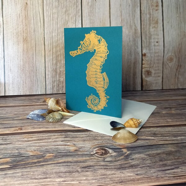 White’s Seahorse greetings card. Original Fine Art Lino print on high quality teal coloured card (blank inside) printed in gold ink