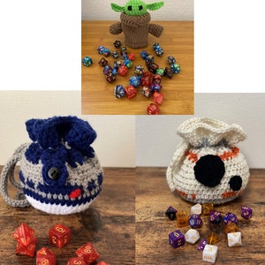May include: Three crocheted dice bags, one shaped like Baby Yoda, one shaped like a Stormtrooper, and one shaped like a BB-8. Each bag is filled with colourful dice.