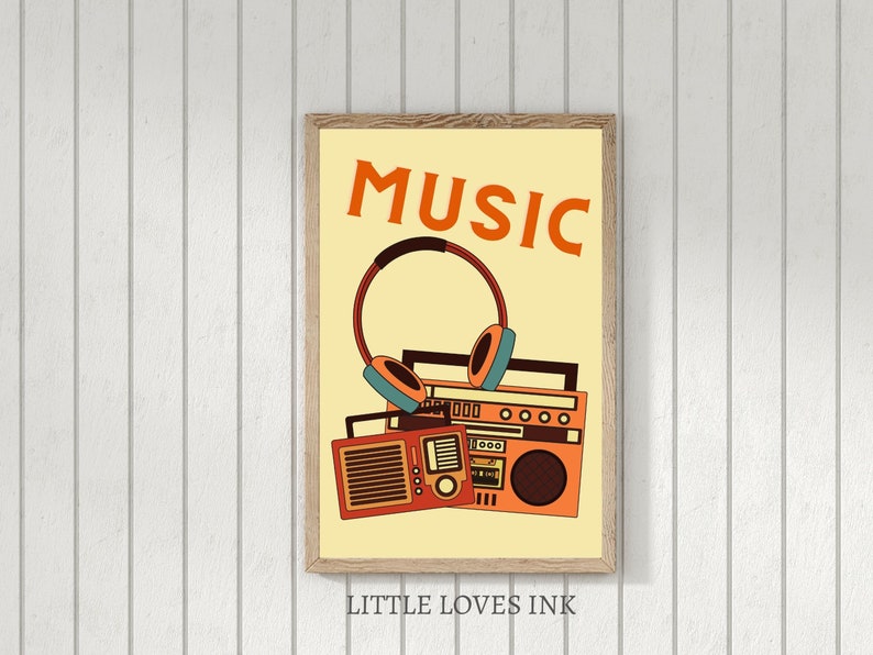 May include: A yellow poster with the word "MUSIC" in orange letters. A vintage boombox with headphones is pictured below the text. The poster has a brown wood frame and the text "LITTLE LOVES INK" is printed below the frame.