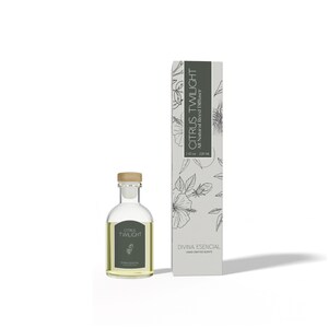 May include: A clear glass bottle with a wooden cap and a label that reads "Citrus Twilight." Next to it is a tall, rectangular box with the same text and floral illustrations. The product is a reed diffuser.