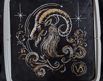 Elaborate embroidery design of the Capricorn zodiac sign, realistic, colorful, with light and shadow, for commercial use by LunaChild on dark fabrics