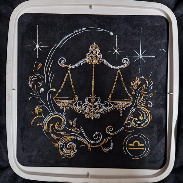 Elaborate embroidery design: realistic, colorful Libra zodiac sign with light and shadow. Commercial use by LunaChild for dark fabrics.