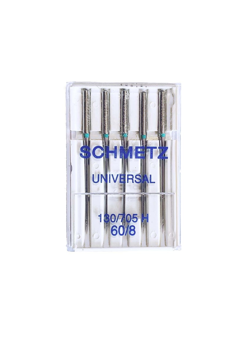 May include: A pack of 6 silver sewing machine needles in a clear plastic case. The needles are labeled "SCHMETZ UNIVERSAL 130/705 H 60/8".