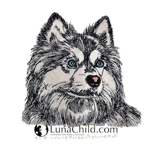 May include: An embroidered patch featuring a detailed portrait of a fluffy dog with black and white fur, striking bright blue eyes, and a pink nose. Below the dog, the text LunaChild.com is printed with a small circular logo and stars.