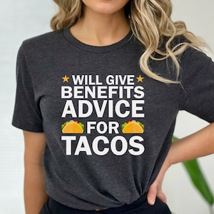 May include: A dark grey t-shirt with white text that reads "Will Give Benefits Advice For Tacos" with a yellow star on either side of the text. Two yellow taco illustrations are on either side of the word "For".
