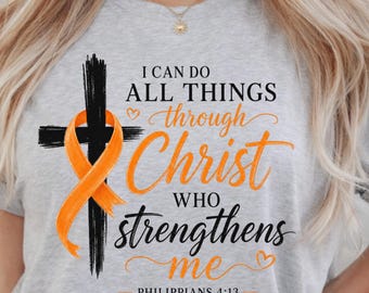 May include: A light gray t-shirt featuring a black cross graphic with an orange awareness ribbon wrapped around it. The text reads: I CAN DO ALL THINGS through Christ WHO strengthens me PHILIPPIANS 4:13 in black and orange script.