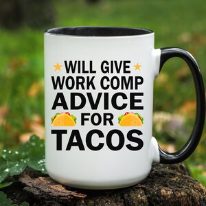 May include: White ceramic mug with a black rim and handle. The mug has a black graphic that says "Will give work comp advice for tacos" with a yellow star on either side of the text and a yellow taco graphic on either side of the word "for".