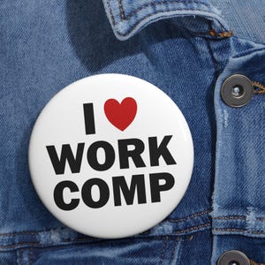 May include: White button with a red heart and black text that reads "I love work comp".