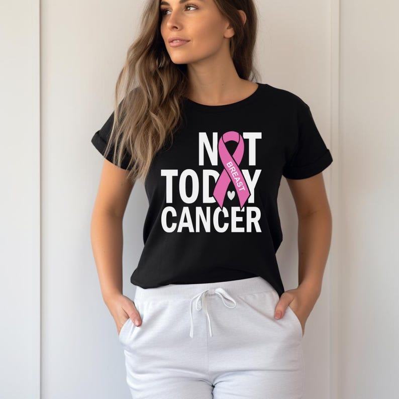 May include: Black t-shirt with a pink ribbon and the text "NOT TODAY CANCER" with the words "BREAST" inside the ribbon.
