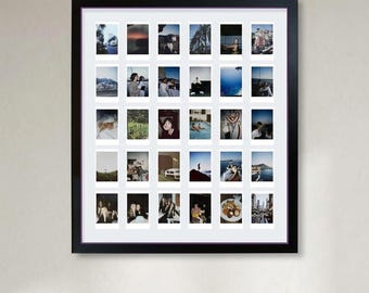 May include: A black rectangular frame containing a white mat with thirty individual rectangular photo slots arranged in a grid. Each slot displays a unique small photograph featuring various outdoor scenes, landscapes, and people.