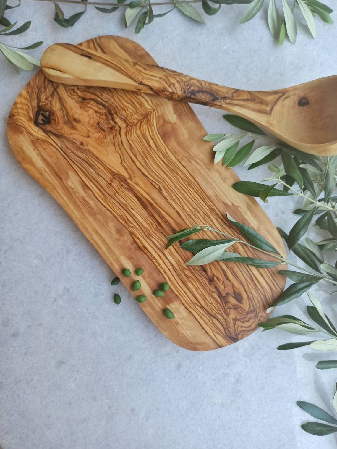 Olive wood cutting board oval. Etsy