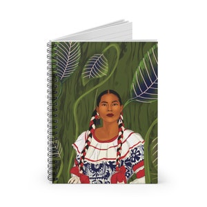May include: A spiral bound notebook with a colorful illustration of a woman wearing a traditional Mexican dress and standing in front of a green leafy background.