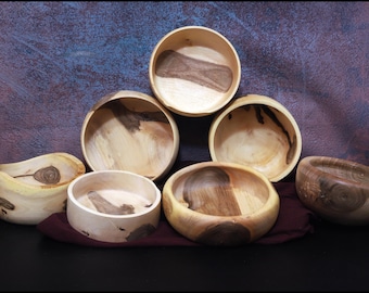 Walnut shells from a tree in the neighboring village, hand-turned with unique grain