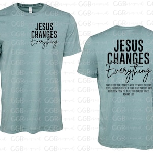 May include: A light blue t-shirt with the text "Jesus Changes Everything" in black on the front and the same text with a bible verse on the back.