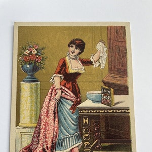 Antique Lavine Soap Trading Card featuring a Woman raising up her skirt and holding a hankie in her other hand