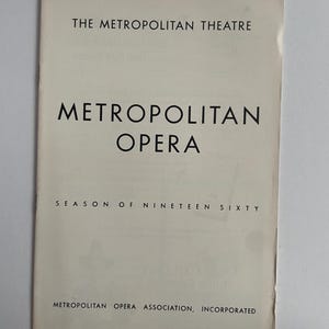 May include: A vintage Metropolitan Opera programme with the title in bold black text. The programme is for the "Season of Nineteen Sixty" and is printed on off-white paper. The Metropolitan Theatre is also mentioned.