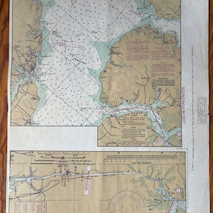 May include: Vintage nautical chart with detailed illustrations of coastal areas, featuring depth soundings in feet, navigational markers, and the text "JOINS PAGE 13". The chart has a beige background with blue and green water areas.