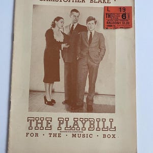 May include: A vintage Playbill program for the play Christopher Blake at the Music Box Theatre. The cover features a sepia-toned photograph of three people in formal attire, with a ticket stub dated Feb 6 1947 attached to the upper right corner.