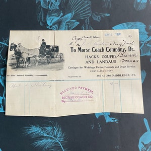 May include: A vintage receipt from Morse Coach Company, dated May 1, 1901, for a carriage service. The receipt is printed on cream-colored paper with black ink and includes the company's address, phone number, and a handwritten signature. The receipt also includes a stamp that says "Received Payment" with the date June 8, 1901.