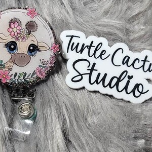 Baby Giraffe badge Reel, Long neck, Sahara Desert, Zoos, mammals, Spots, Africa, Kingdom, Horns, Wild, Big Eyes, Ears, Yellow Spots