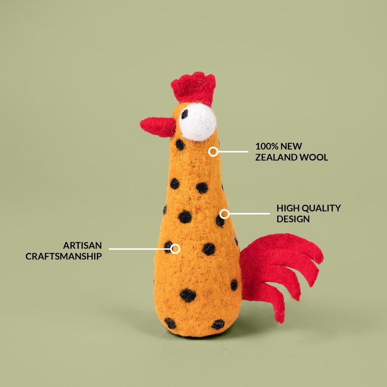May include: A felt rooster toy with a red comb and tail, black polka dots on a yellow body, and the text "100% NEW ZEALAND WOOL", "HIGH QUALITY DESIGN", and "ARTISAN CRAFTSMANSHIP" on the image.