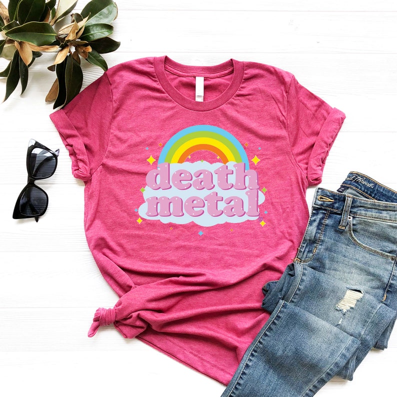 May include: Pink t-shirt with a rainbow and a cloud that says "death metal" in pink letters.