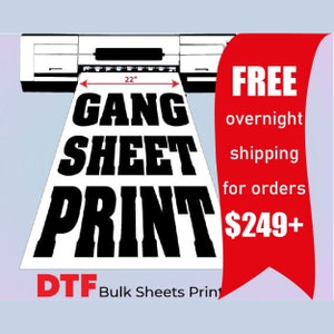 May include: A white sheet with the words "GANG SHEET PRINT" in bold black letters is being printed from a machine. The sheet measures 22 inches wide. The image also includes the text "DTF Bulk Sheets Print".