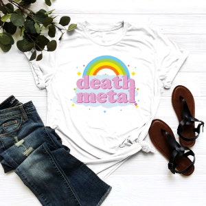 May include: White t-shirt with a rainbow and the words "death metal" in pink letters on a blue cloud.