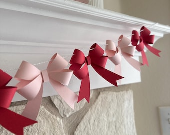 Guirnalda de lazos de papel rosa y rojo: pancarta de fiesta 3D
