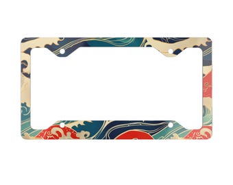 May include: License plate frame with a Japanese wave pattern. The frame features a repeating design of blue, red, and cream-colored waves. The frame has a rectangular shape with four mounting holes.