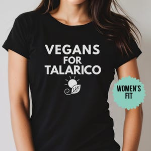 May include: Black t-shirt with the white text "VEGANS FOR TALARICO" and a graphic of a sun and leaf. The shirt also has a "WOMEN'S FIT" tag.