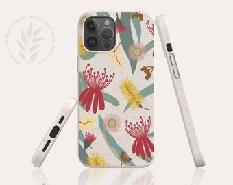 May include: A white phone case with a floral pattern featuring red, yellow, and green flowers. The case is made from plant-based biodegradable materials. "Made from plant-based biodegradable materials" is printed on the case.