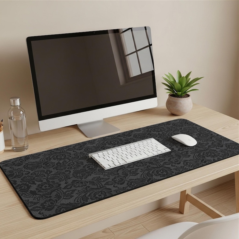 Stylish black polka dot desk mat with white dots and stitched edges. A large extended mouse pad in a retro-chic monochrome style, perfect for coquette, minimalist, or vintage-inspired workspaces. Adds a classic and sophisticated touch to any office setup.