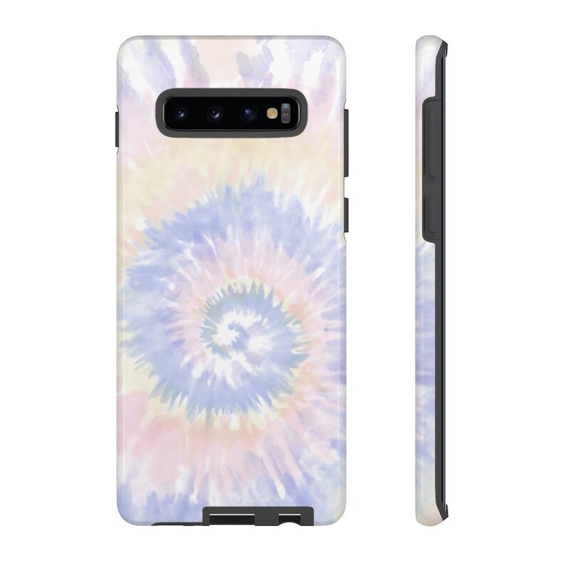 May include: A phone case with a tie-dye pattern in shades of pink, blue, and white. The case is designed for a Samsung Galaxy S10.