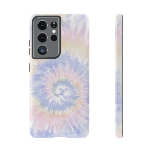 May include: A phone case with a tie-dye pattern in shades of pink, blue, and yellow. The case has a black camera cutout.
