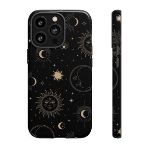 May include: Black phone case with a gold celestial pattern of suns, moons, and stars.