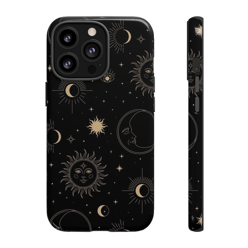 May include: Black phone case with a gold celestial pattern of suns, moons, and stars.