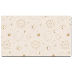 May include: A beige background with a repeating pattern of gold suns, moons, and stars. The suns and moons have faces drawn on them.