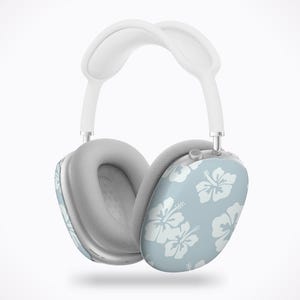 May include: White and gray over-ear headphones with a light blue ear cup featuring a white floral pattern. The headband and ear cushions are white and gray, respectively. The headphones are designed for comfort and style.
