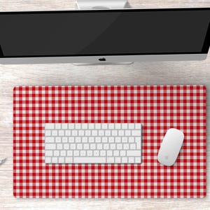 May include: A red and white checkered desk mat with a white keyboard and a white mouse on top.