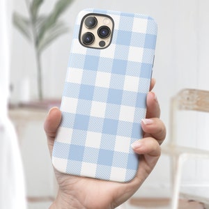 May include: A light blue and white checked phone case for an iPhone.