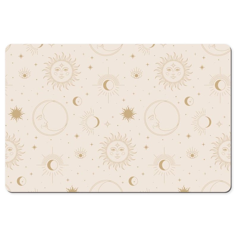 May include: A beige background with a repeating pattern of gold suns, moons, and stars. The suns and moons have faces and are surrounded by rays. The stars are small and scattered throughout the pattern.