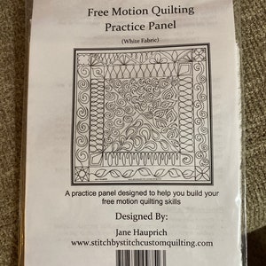 May include: A white fabric practice panel for free motion quilting. The panel features a variety of quilting designs, including swirls, loops, and geometric patterns. The panel is designed to help you build your free motion quilting skills. Designed by Jane Hauprich. www.stitchbystitchcustomquilting.com