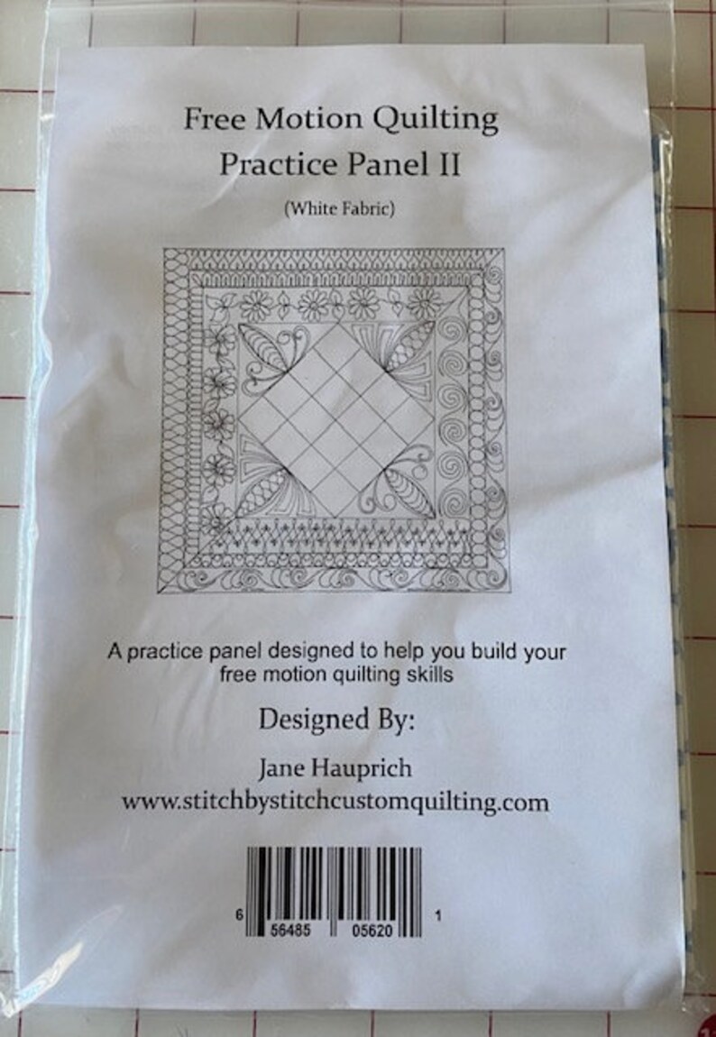 May include: A black and white quilting practice panel with a square design and intricate borders. The panel is labeled "Free Motion Quilting Practice Panel II (White Fabric)". It includes the text "Designed By: Jane Hauprich" and the website "www.stitchbystitchcustomquilting.com".